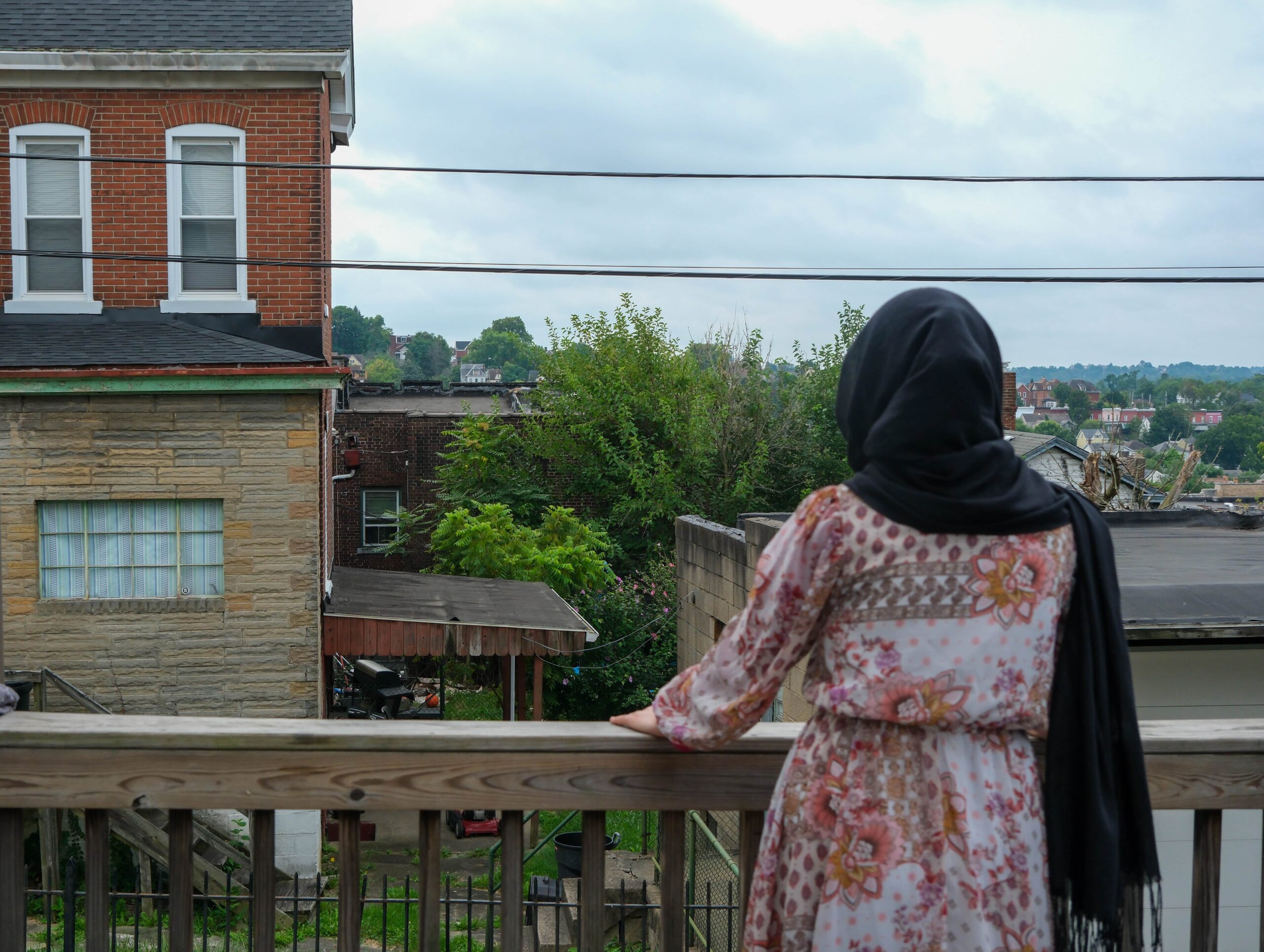 As she fled Afghanistan, her husband was stopped at the gate