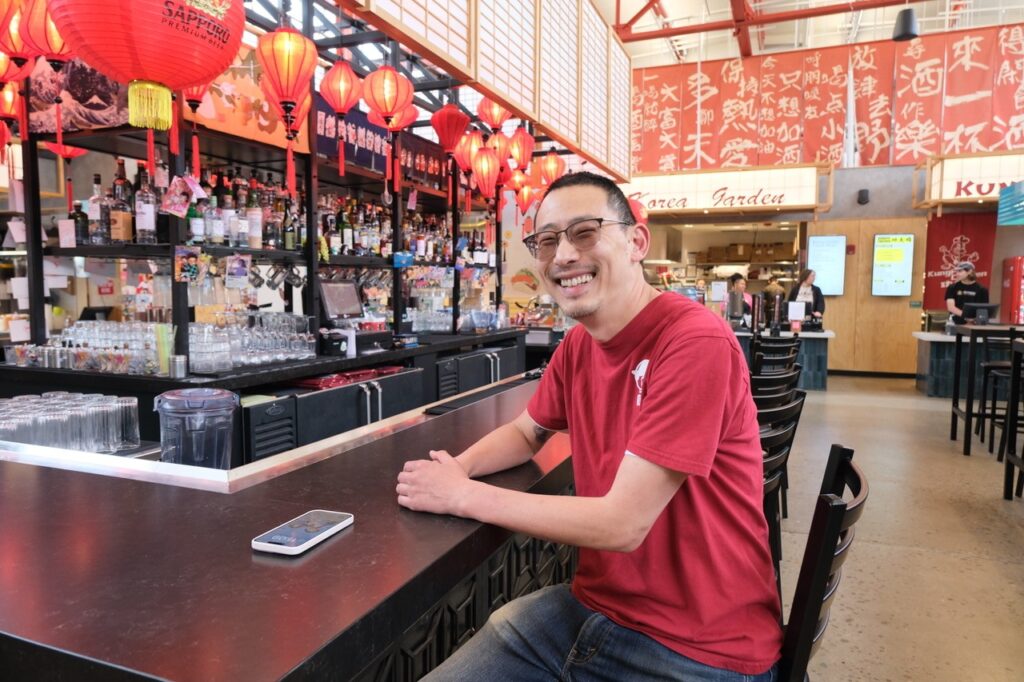 Alex Tang was seated at the bar in the center of the Novo Asian Food Hall. 