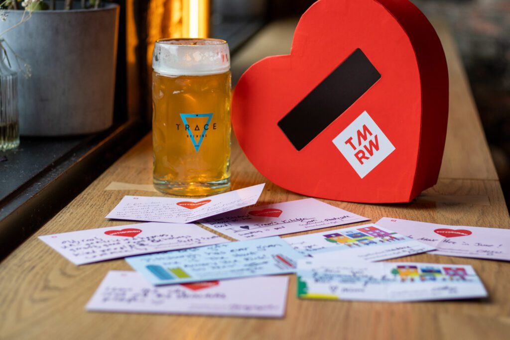 A heart-shaped box and a Trace Brewing beer are pictured with love letters from the community 