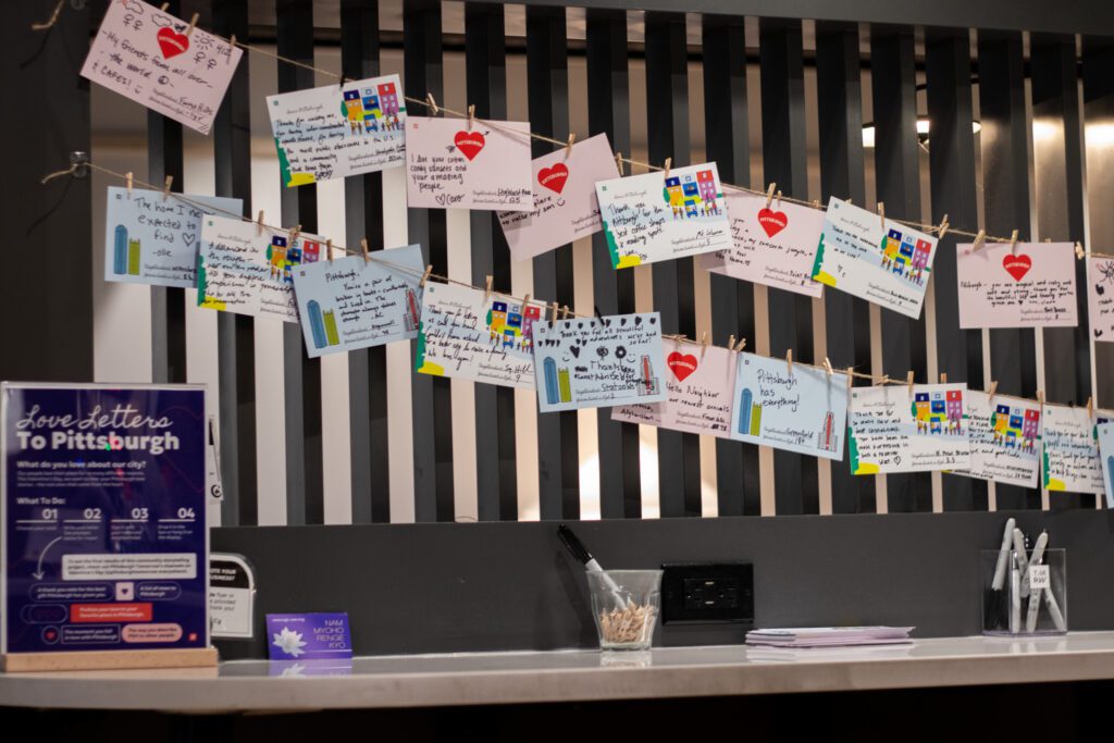 Love letters hang on a clothesline at a coffee shop