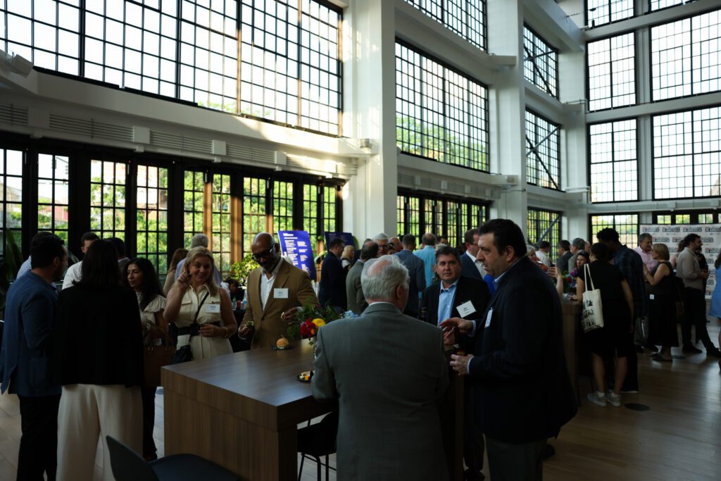 A party in a large room with many windows