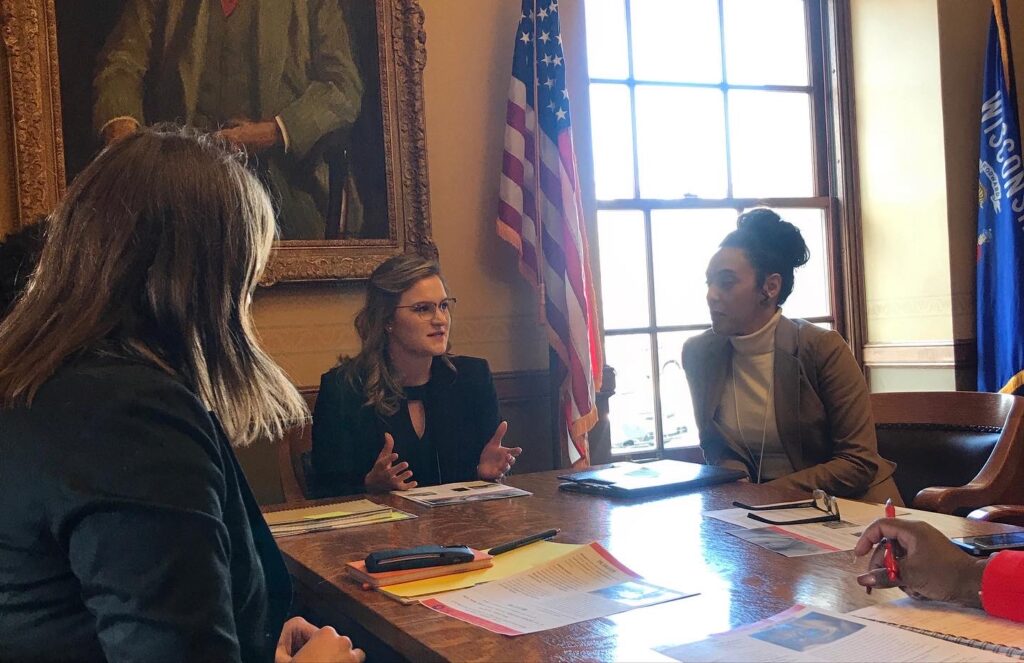 Haley seated with a group of women.