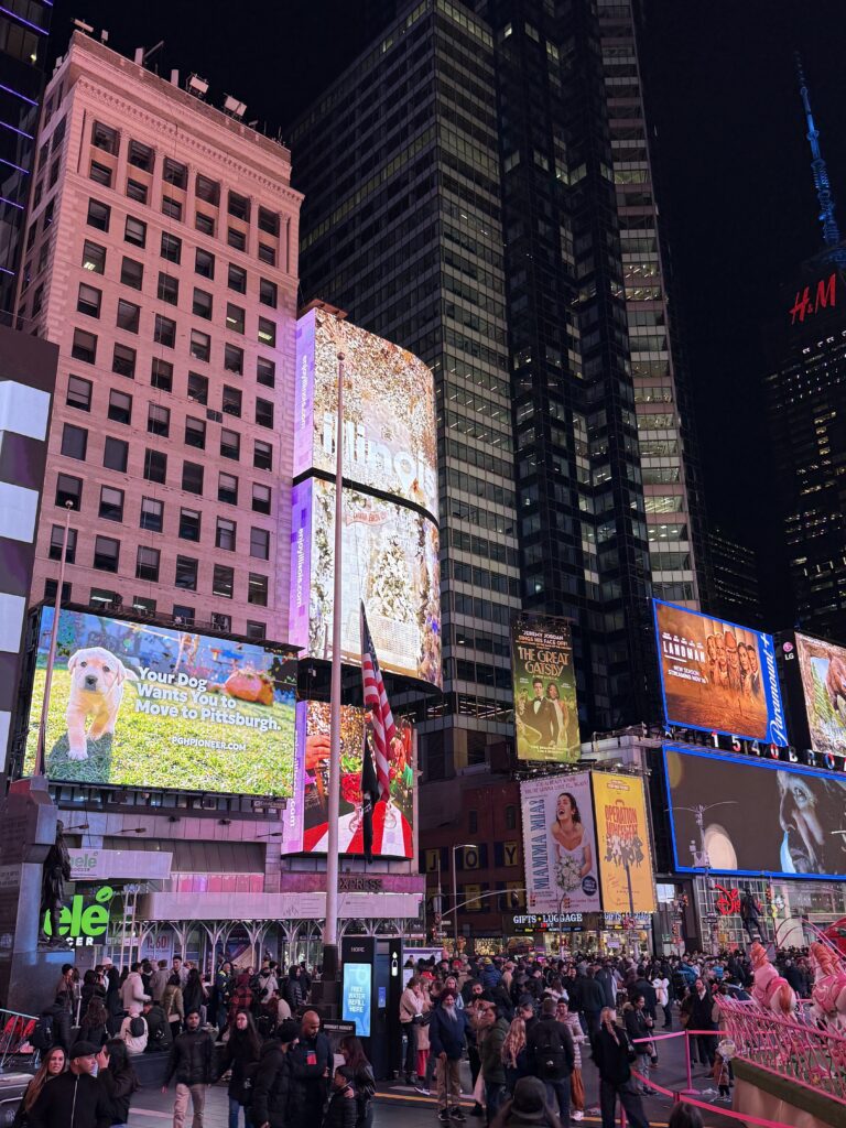 A night scene in Times Square featuring PIttsburgh Tomorrow's billboard